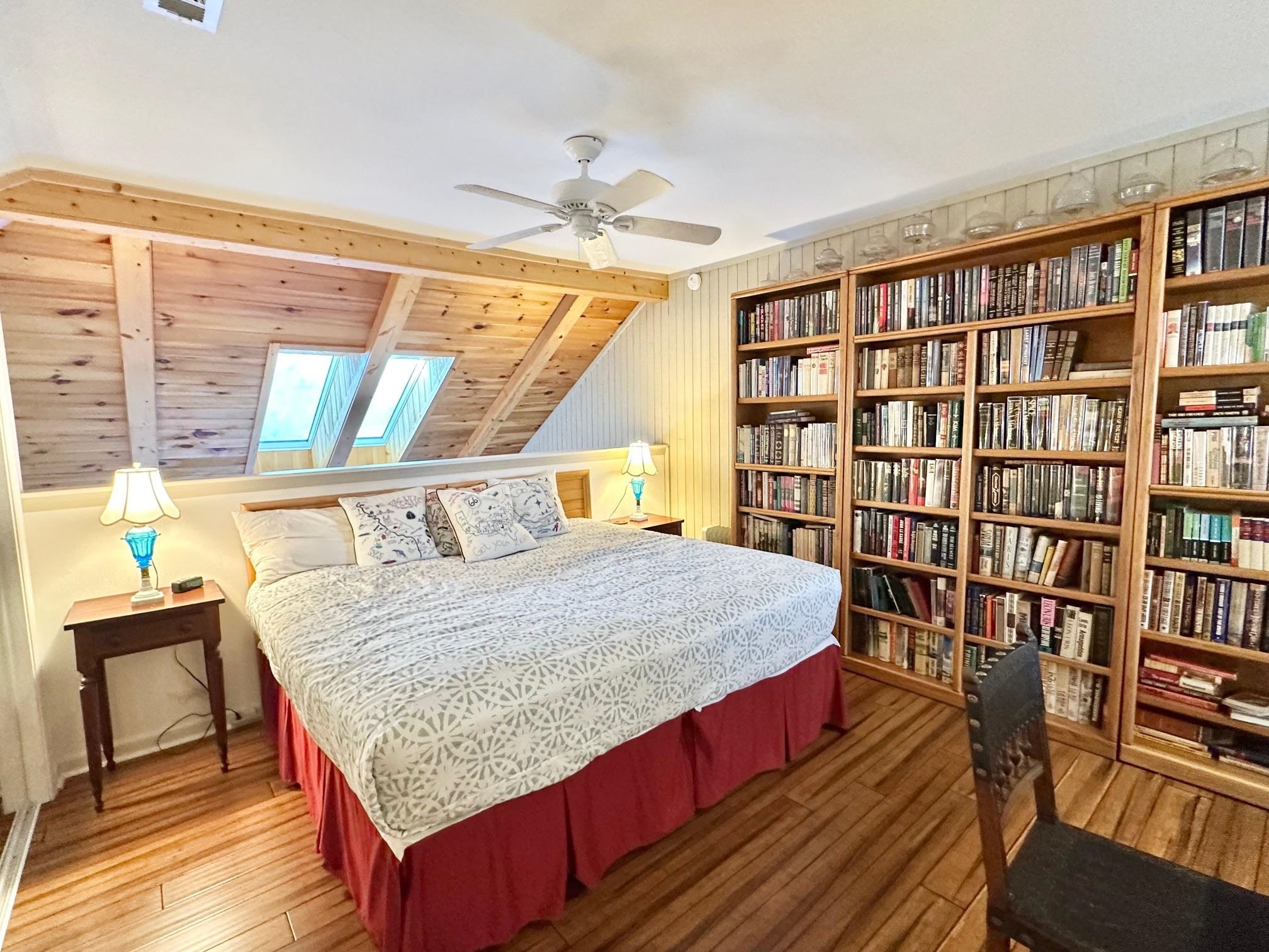 3206 North Ridge Wintergreen, VA 22967 - Photo 31 of 41 a bedroom with a bed a large window and book shelf