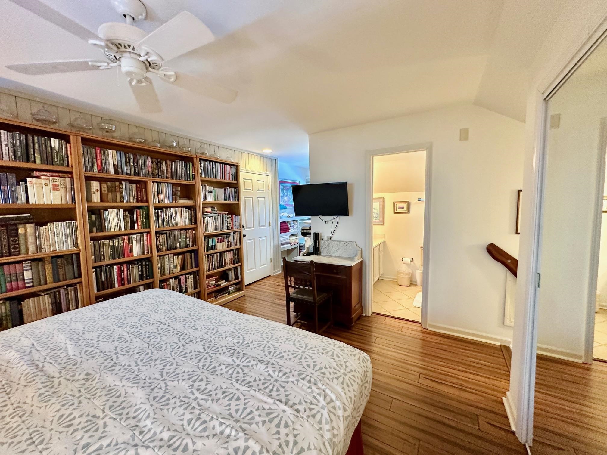 3206 North Ridge Wintergreen, VA 22967 - Photo 35 of 41 a bedroom with a bed cabinets and a flat screen tv