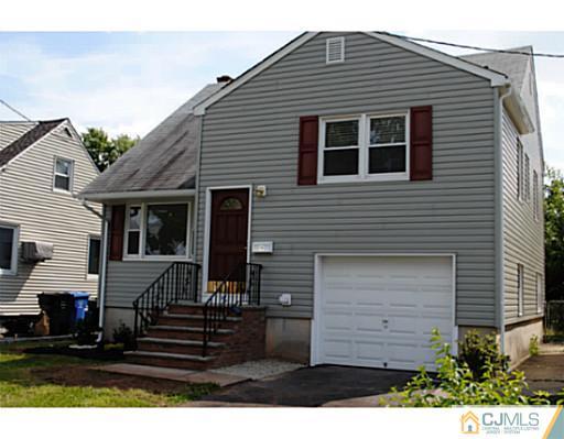19 Highfield Road Colonia, NJ 07067 - Photo 1 of 17 a front view of a house with a yard