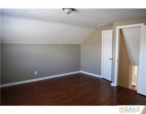 19 Highfield Road Colonia, NJ 07067 - Photo 11 of 17 a view of an empty room with wooden floor