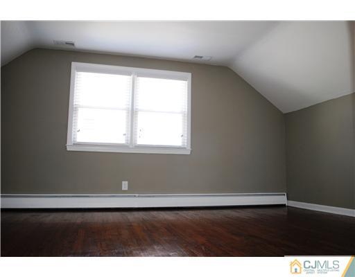 19 Highfield Road Colonia, NJ 07067 - Photo 13 of 17 a view of a room that has a window in it
