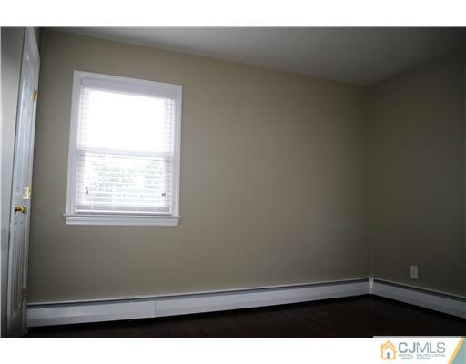 19 Highfield Road Colonia, NJ 07067 - Photo 14 of 17 a view of an empty room with a window