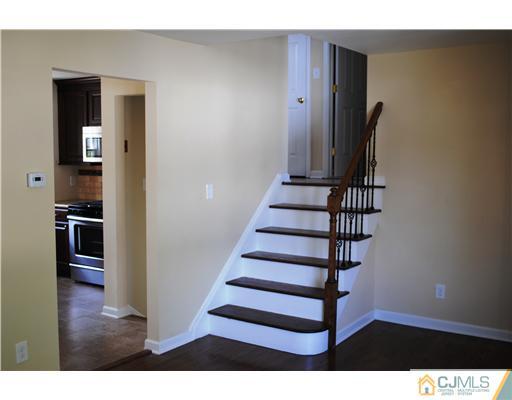 19 Highfield Road Colonia, NJ 07067 - Photo 4 of 17 a view of entryway and hall with wooden floor