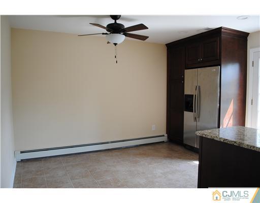 19 Highfield Road Colonia, NJ 07067 - Photo 5 of 17 a view of an empty room with wooden floor