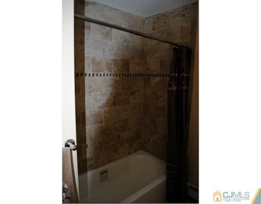 19 Highfield Road Colonia, NJ 07067 - Photo 9 of 17 a bathroom with a bathtub