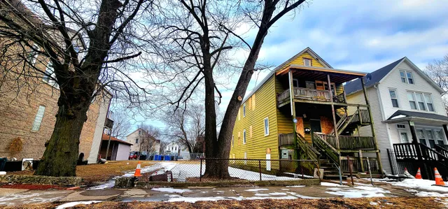 a front view of a building with street view