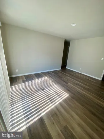 a view of a livingroom with wooden floor