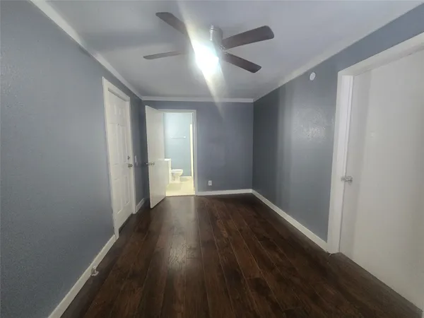 a kitchen with a sink a stove and cabinets