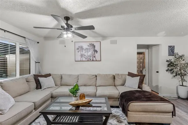 a living room with furniture and a large window