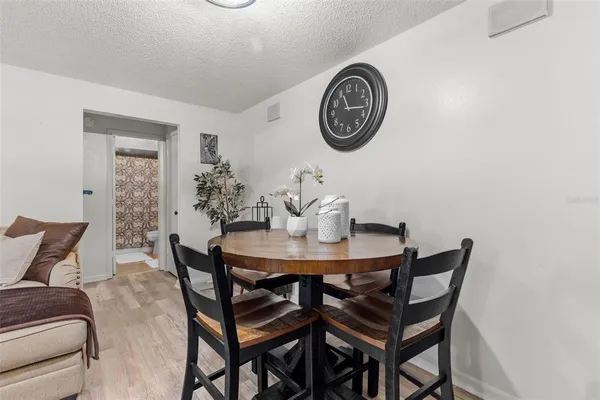 a view of a dining room with furniture and a table