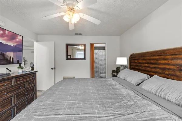 a bedroom with a bed and a dresser