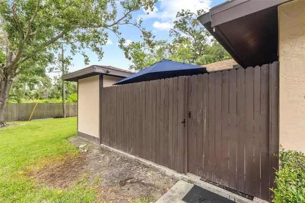 a backyard of a house with lots of green space