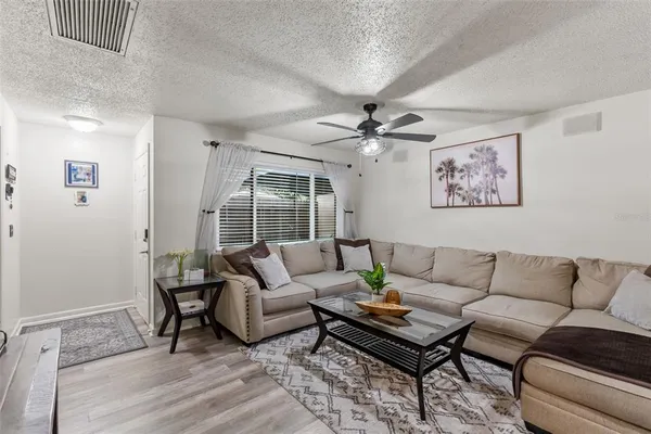 a living room with furniture and a large window