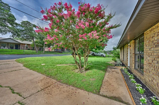 a front view of a house with garden
