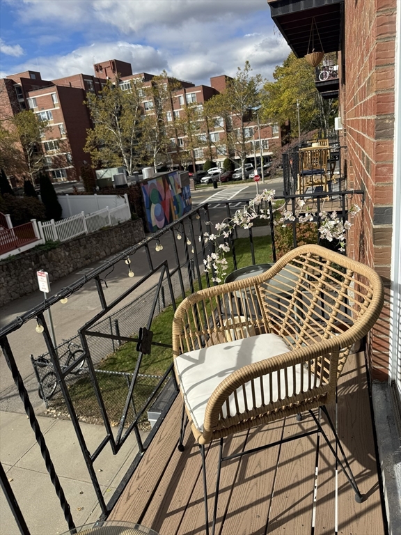 8 Robinwood Avenue, Unit 6 Boston, MA 02130 - Photo 5 of 5 a view of a balcony with chairs