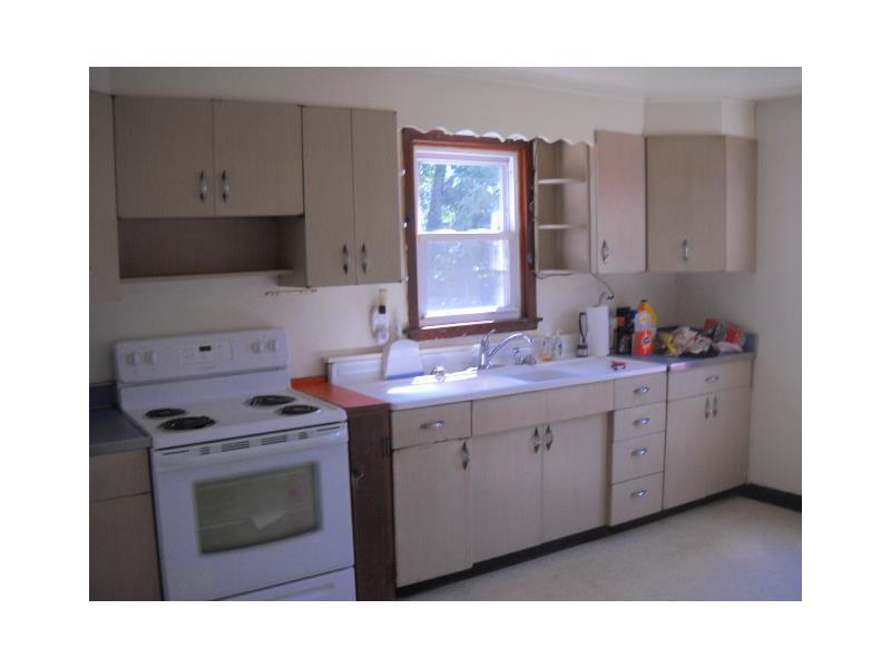 148 Miller Road Rochester, PA 15074 - Photo 5 of 11 Kitchen. Great windows to see outside and door to patio.
