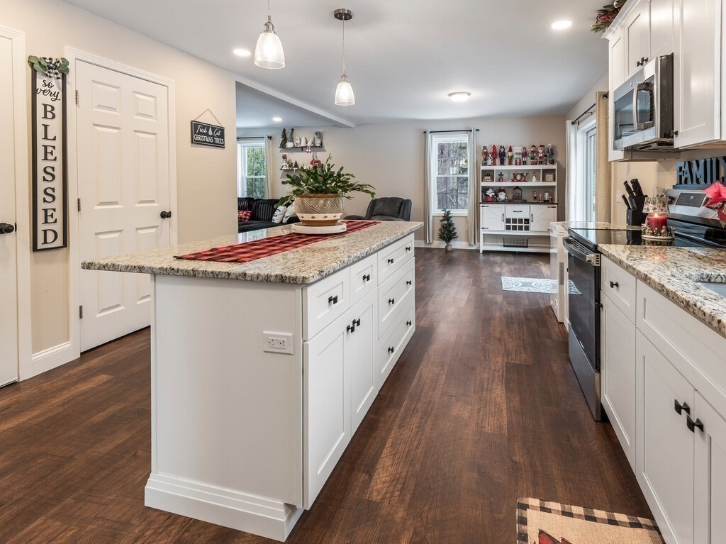 46 Baldwinville State Road Winchendon, MA 01475 - Photo 6 of 37 a large kitchen with stainless steel appliances granite countertop a lot of counter space and wooden floor