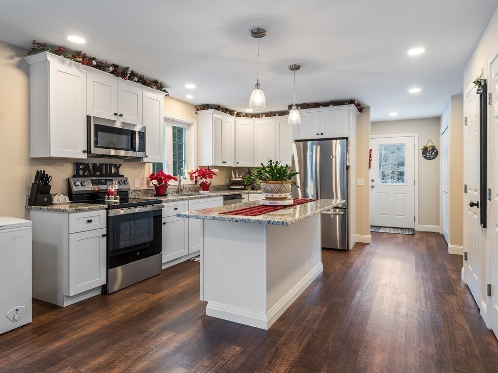 46 Baldwinville State Road Winchendon, MA 01475 - Photo 9 of 37 a kitchen with refrigerator a microwave and wooden floor