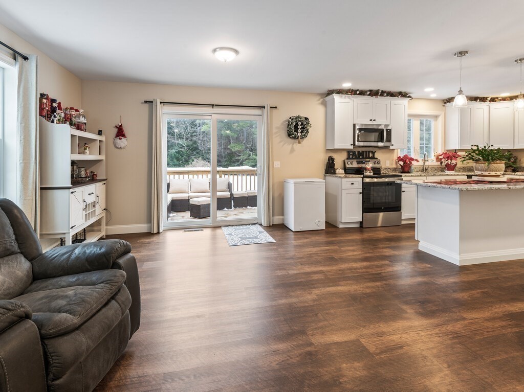 46 Baldwinville State Road Winchendon, MA 01475 - Photo 10 of 37 a living room with furniture and a kitchen with kitchen island