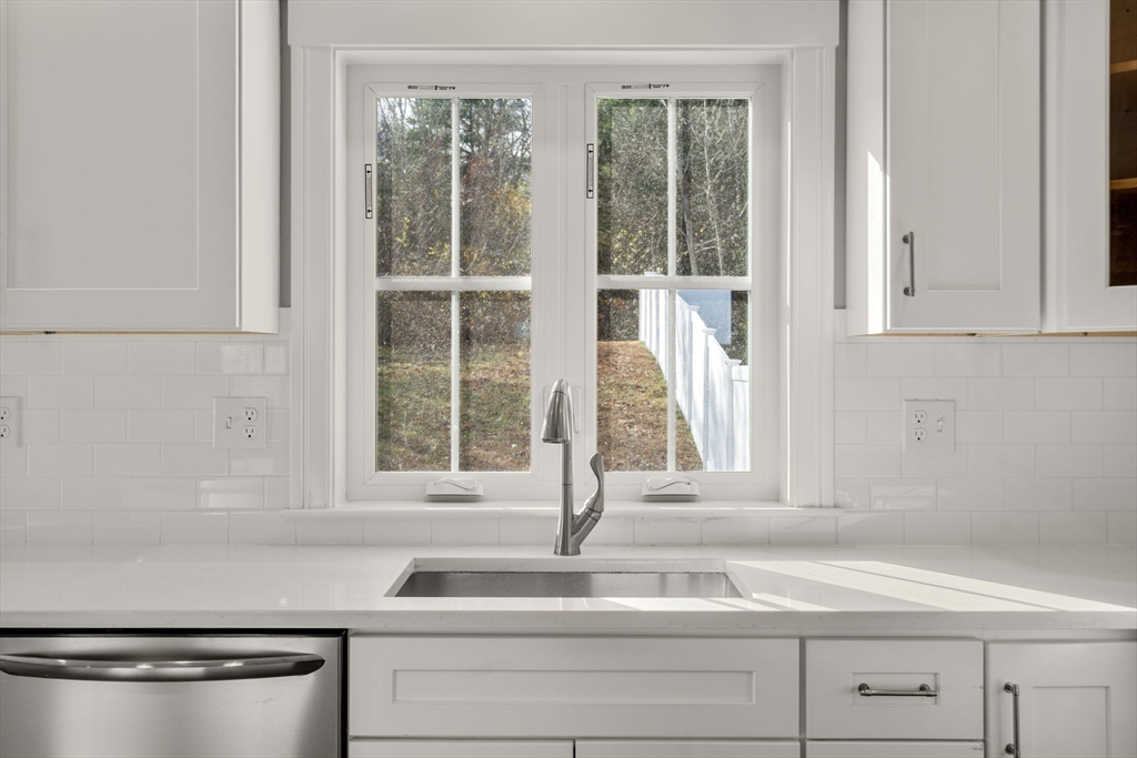 93 Providence Street, Unit B Mendon, MA 01756 - Photo 15 of 37 a bathroom with a sink and a window