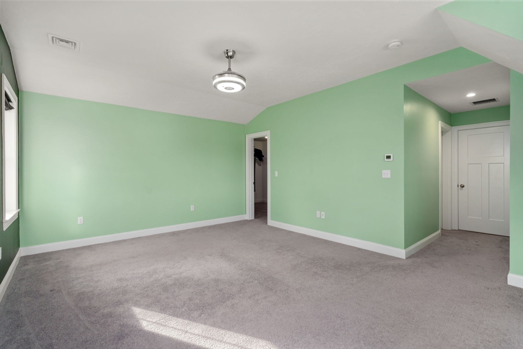 93 Providence Street, Unit B Mendon, MA 01756 - Photo 26 of 37 a view of an empty room with a fireplace