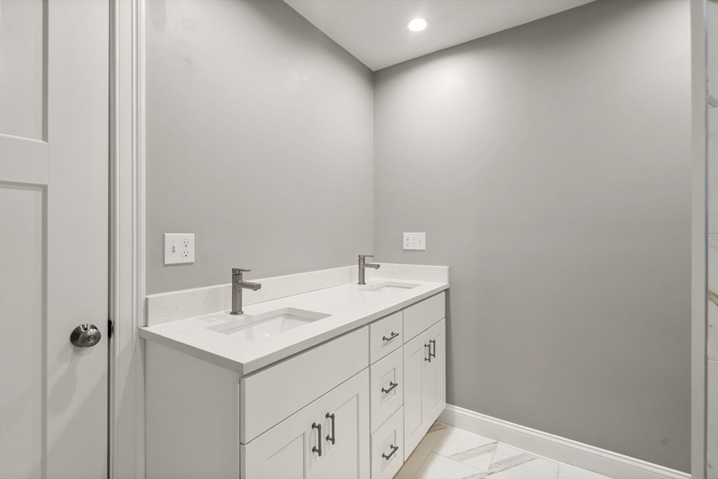 93 Providence Street, Unit B Mendon, MA 01756 - Photo 27 of 37 a bathroom with a sink and a mirror