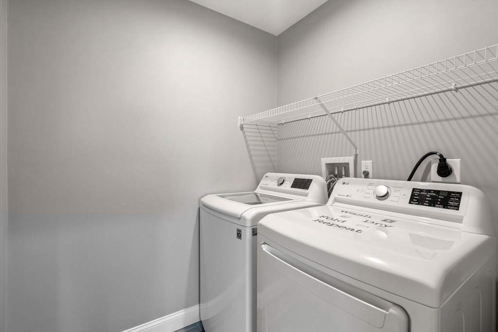 93 Providence Street, Unit B Mendon, MA 01756 - Photo 28 of 37 a utility room with dryer and washer