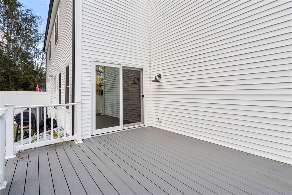 93 Providence Street, Unit B Mendon, MA 01756 - Photo 29 of 37 a view of a house with wooden deck