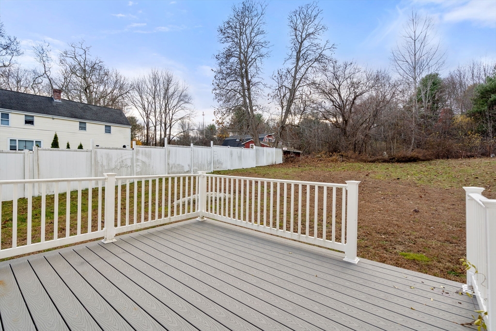 93 Providence Street, Unit B Mendon, MA 01756 - Photo 30 of 37 a view of a wooden deck