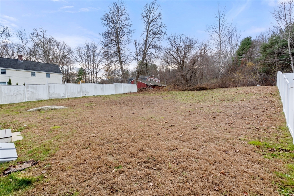 93 Providence Street, Unit B Mendon, MA 01756 - Photo 34 of 37 a view of a yard with a tree