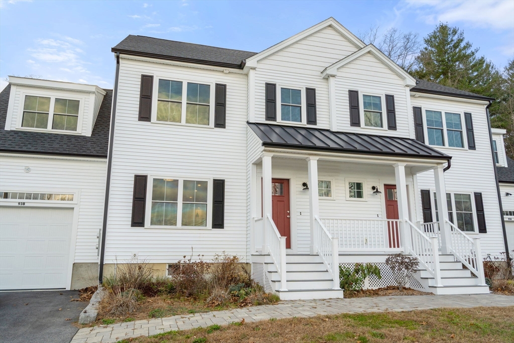 93 Providence Street, Unit B Mendon, MA 01756 - Photo 5 of 37 a front view of a house with a yard