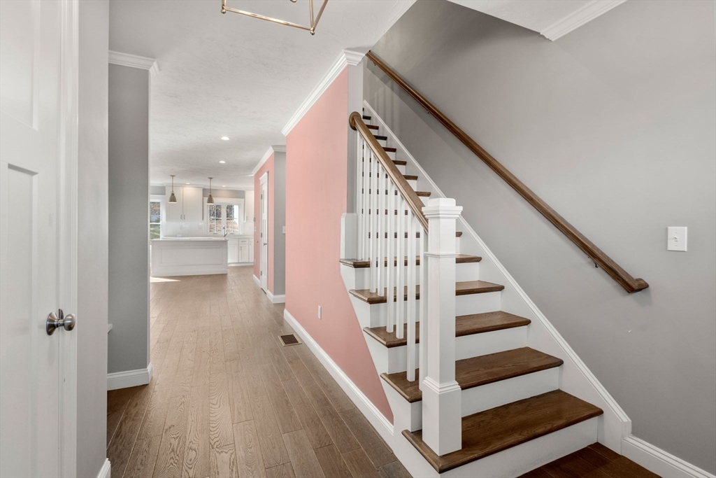 93 Providence Street, Unit B Mendon, MA 01756 - Photo 8 of 37 a view of entryway and hall with wooden floor