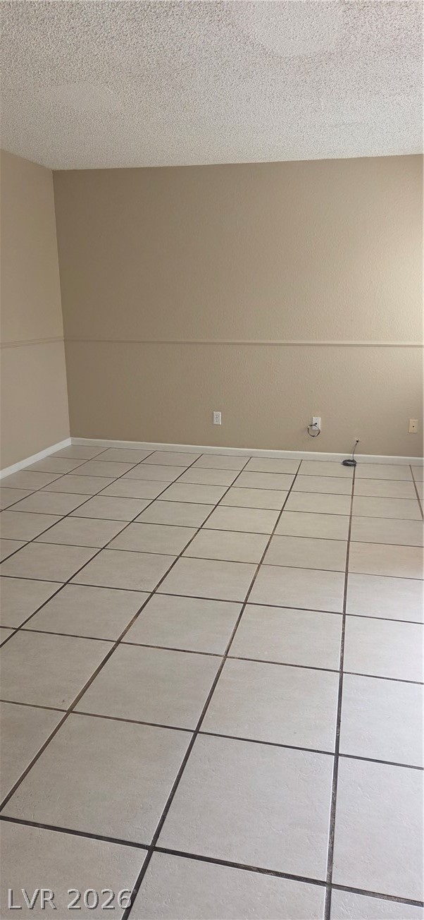 571 Roxella Lane, Unit C Las Vegas, NV 89110 - Photo 14 of 14 This versatile room features tiled flooring and ample wall space, perfect for any design vision.