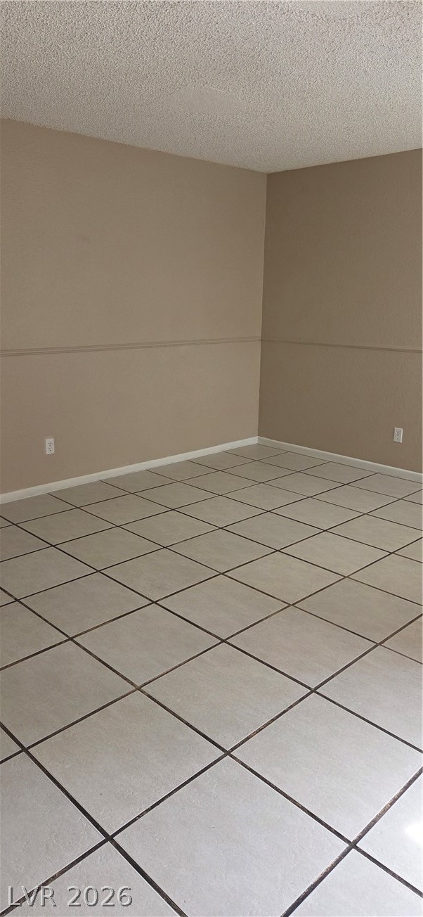 571 Roxella Lane, Unit C Las Vegas, NV 89110 - Photo 4 of 14 This versatile room features durable tile flooring, offering a blank canvas for personalization.