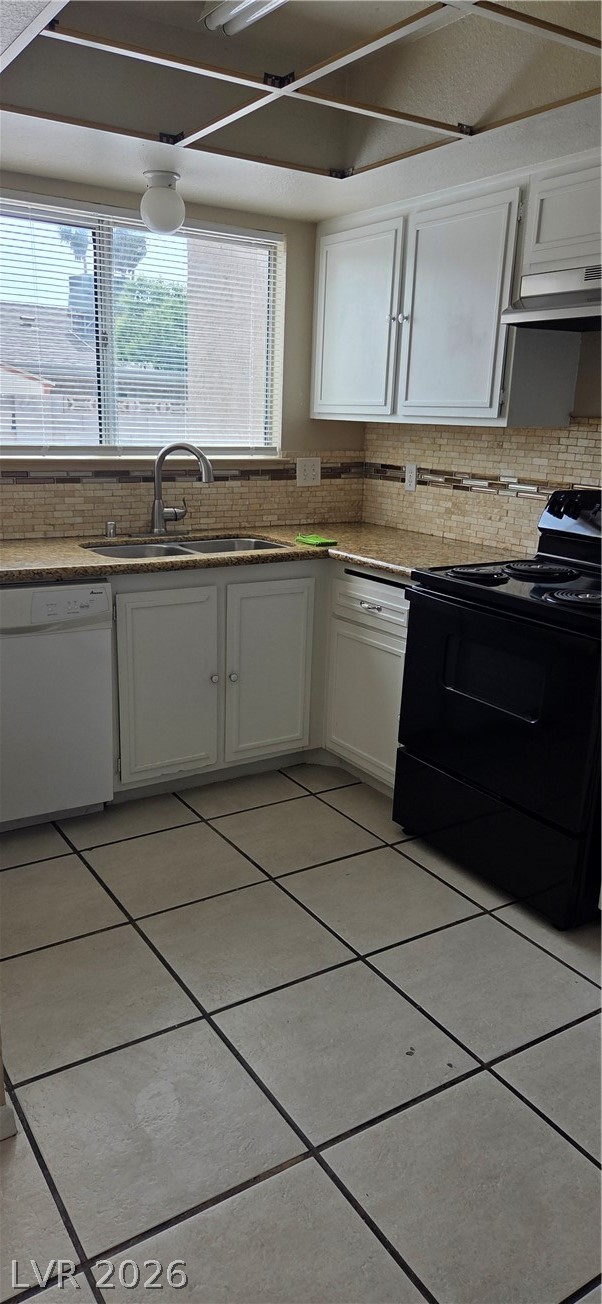 571 Roxella Lane, Unit C Las Vegas, NV 89110 - Photo 6 of 14 This kitchen features sleek countertops, classic cabinetry, and durable tile flooring for everyday living.