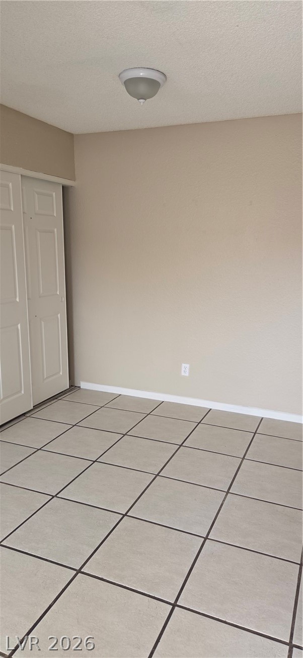 571 Roxella Lane, Unit C Las Vegas, NV 89110 - Photo 7 of 14 This clean room offers bright lighting and durable tile flooring, creating a comfortable living space.