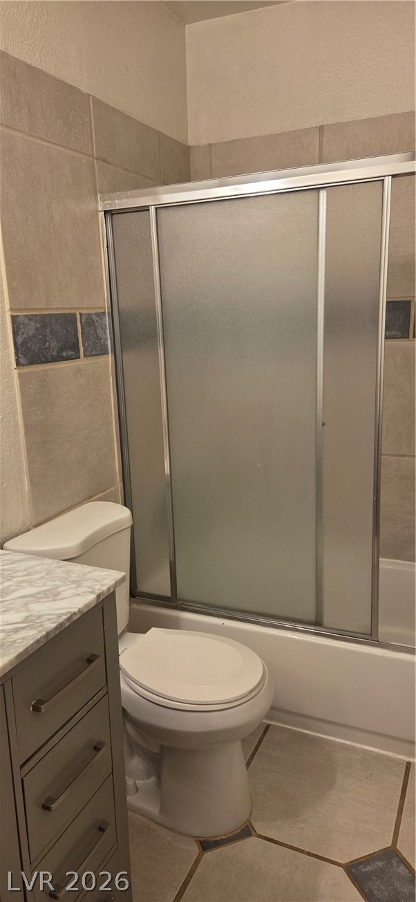 571 Roxella Lane, Unit C Las Vegas, NV 89110 - Photo 8 of 14 This clean and functional bathroom features a tiled shower and contemporary vanity.