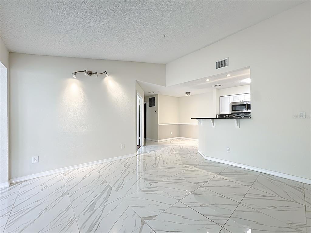 232 Afton Square, Unit 201 Altamonte Springs, FL 32714 - Photo 18 of 54 a view of a kitchen with a sink and wooden floor