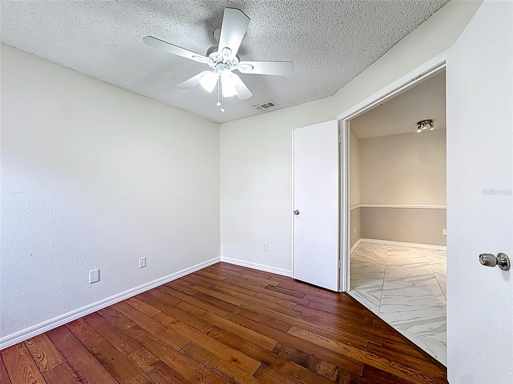 232 Afton Square, Unit 201 Altamonte Springs, FL 32714 - Photo 35 of 54 wooden floor in an empty room