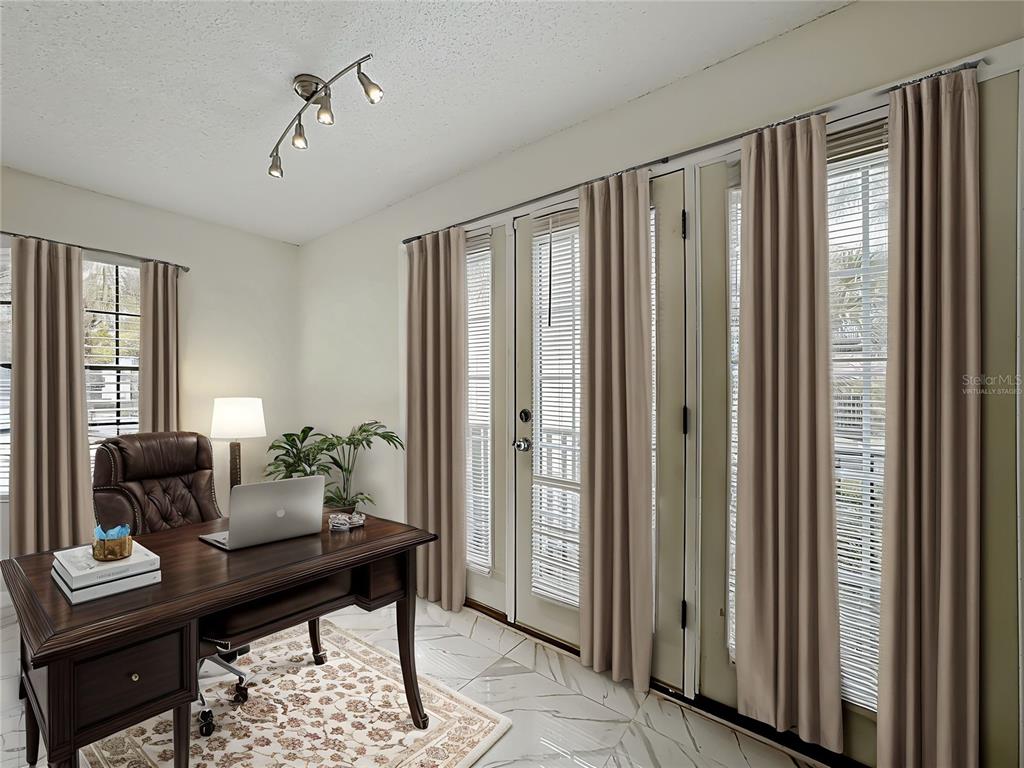 232 Afton Square, Unit 201 Altamonte Springs, FL 32714 - Photo 4 of 54 a view of a workspace with furniture and a window