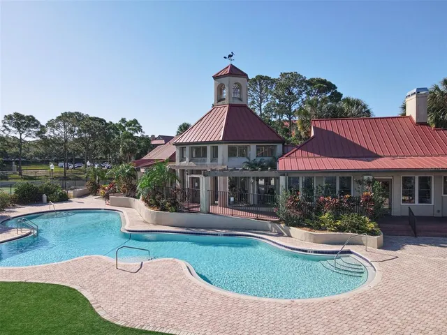 a view of a patio that has a table and chairs