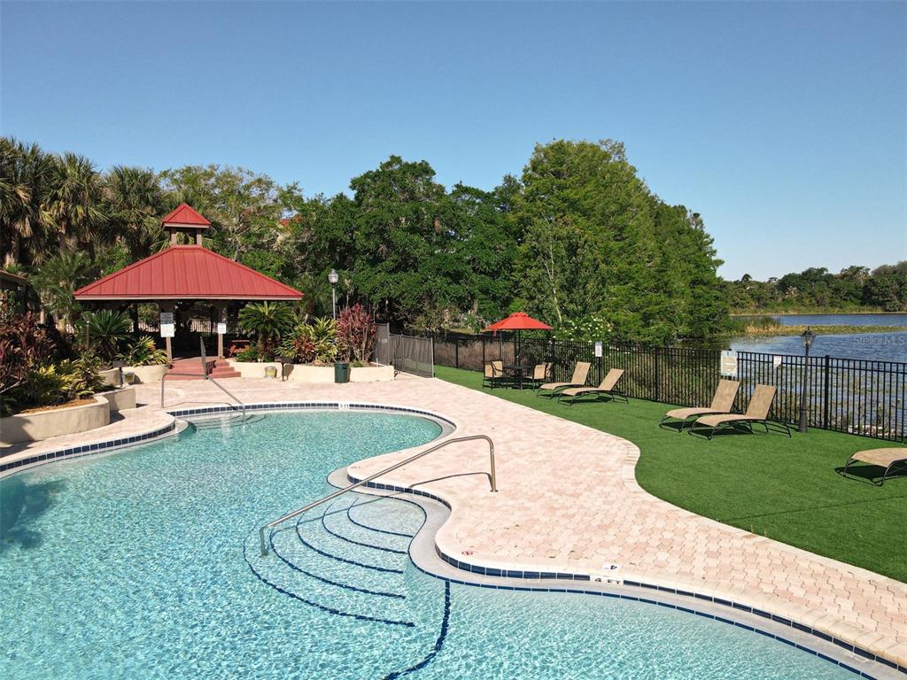 232 Afton Square, Unit 201 Altamonte Springs, FL 32714 - Photo 47 of 54 a swimming pool with outdoor seating yard and barbeque oven