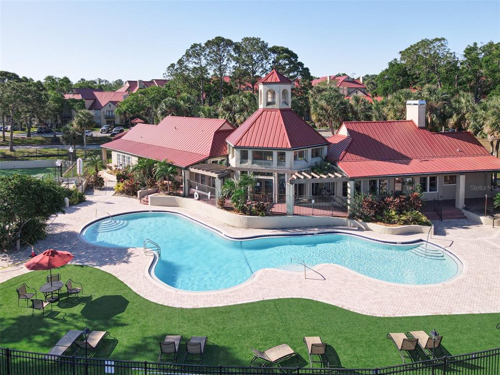 232 Afton Square, Unit 201 Altamonte Springs, FL 32714 - Photo 51 of 54 a view of pool with lawn chairs and large trees