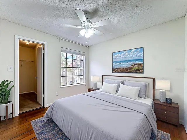 a bedroom with a large bed and a window