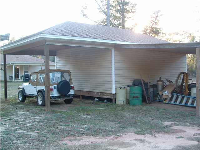893 Lighthouse Church Road Holt, FL 32564 - Photo 12 of 24 a view of a house with backyard