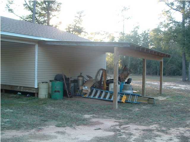 893 Lighthouse Church Road Holt, FL 32564 - Photo 13 of 24 a view of a house with backyard