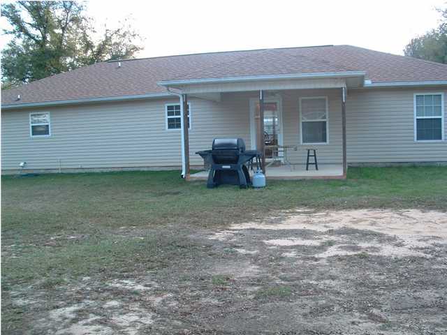 893 Lighthouse Church Road Holt, FL 32564 - Photo 15 of 24 a front view of a house with garden