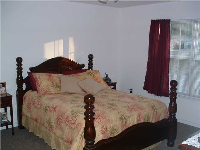 893 Lighthouse Church Road Holt, FL 32564 - Photo 16 of 24 a bedroom with a bed and a mirror