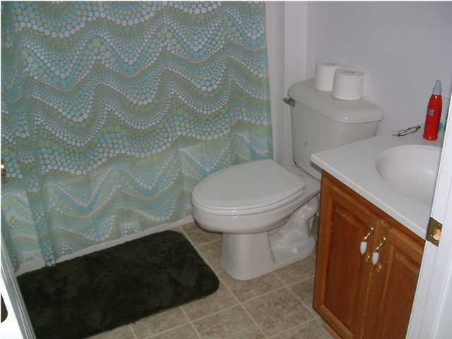 893 Lighthouse Church Road Holt, FL 32564 - Photo 21 of 24 a bathroom with a sink and a toilet