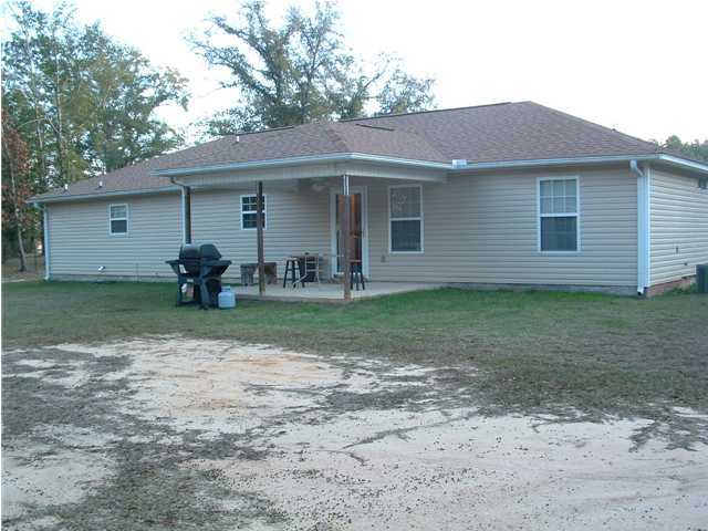 893 Lighthouse Church Road Holt, FL 32564 - Photo 8 of 24 a front view of a house with garden